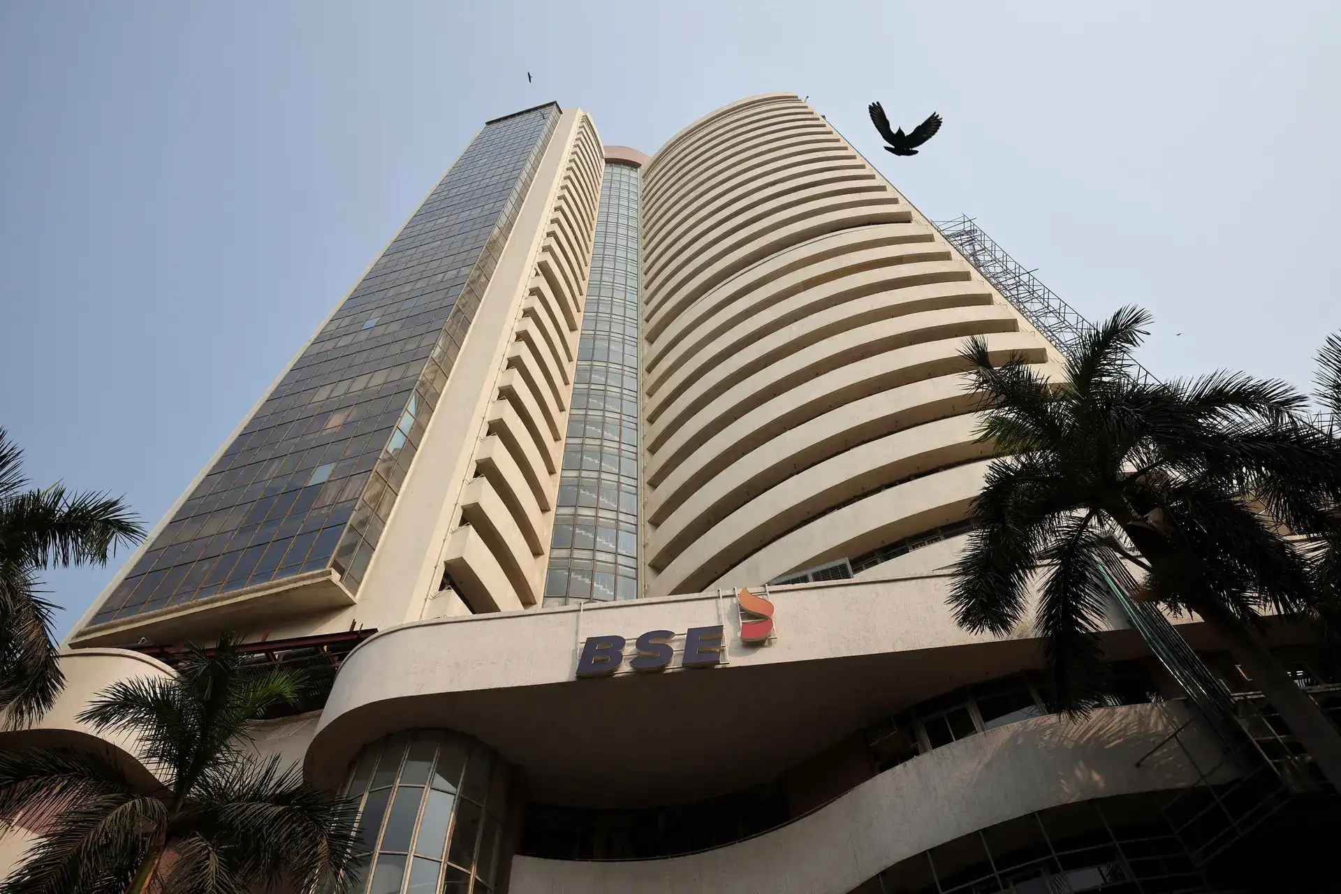 A bird flies near the Bombay Stock Exchange A bird flies near the Bombay Stock Exchange